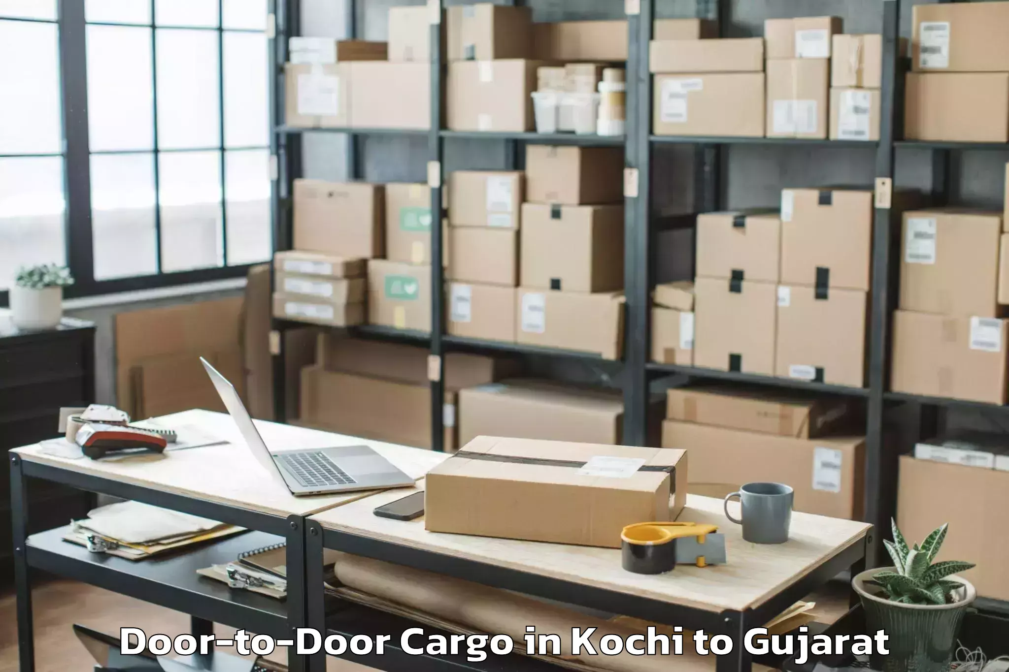 Reliable Kochi to Khambhalia Door To Door Cargo